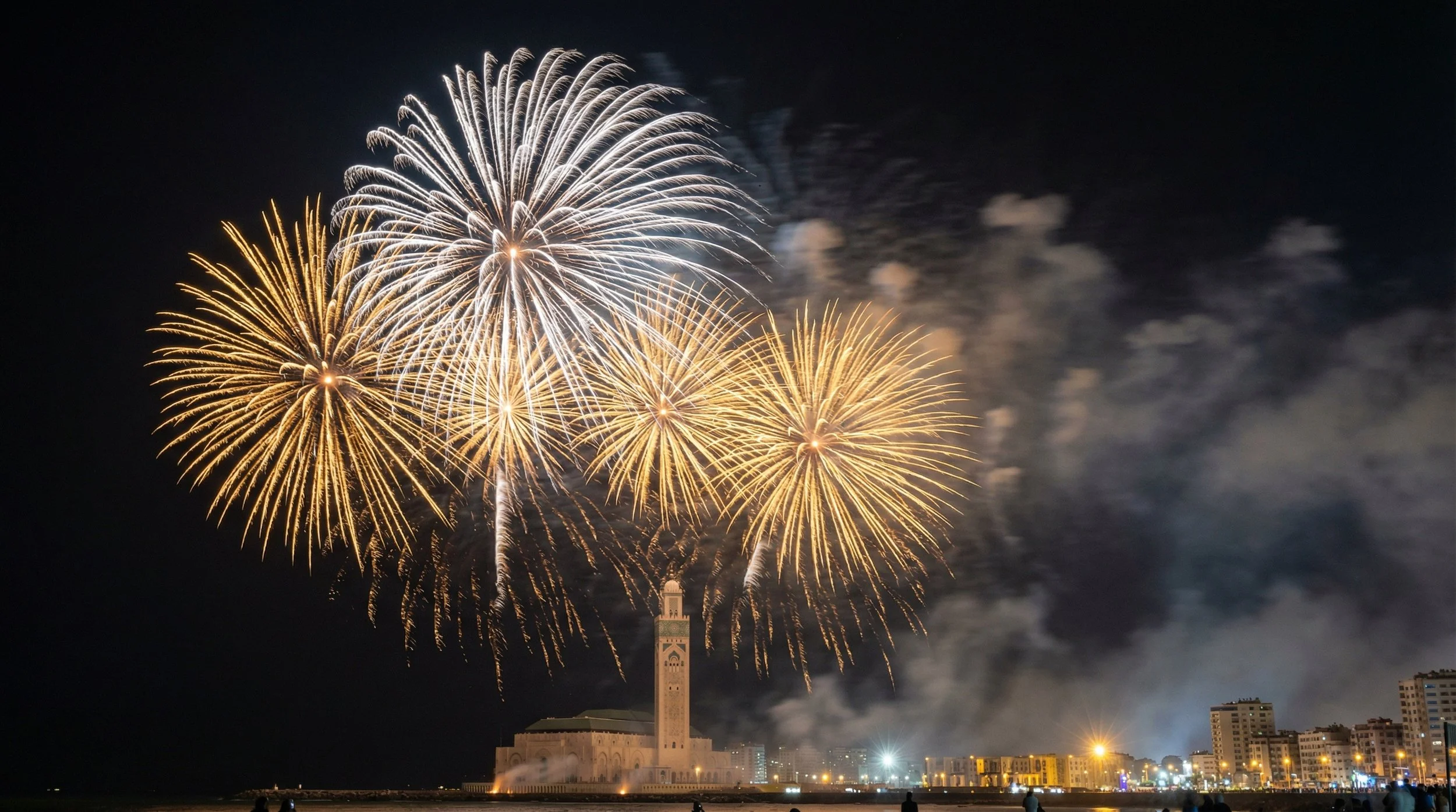 Golden fireworks seen through the arches of the Hassan II Mosque in Casablanca during Throne Day
