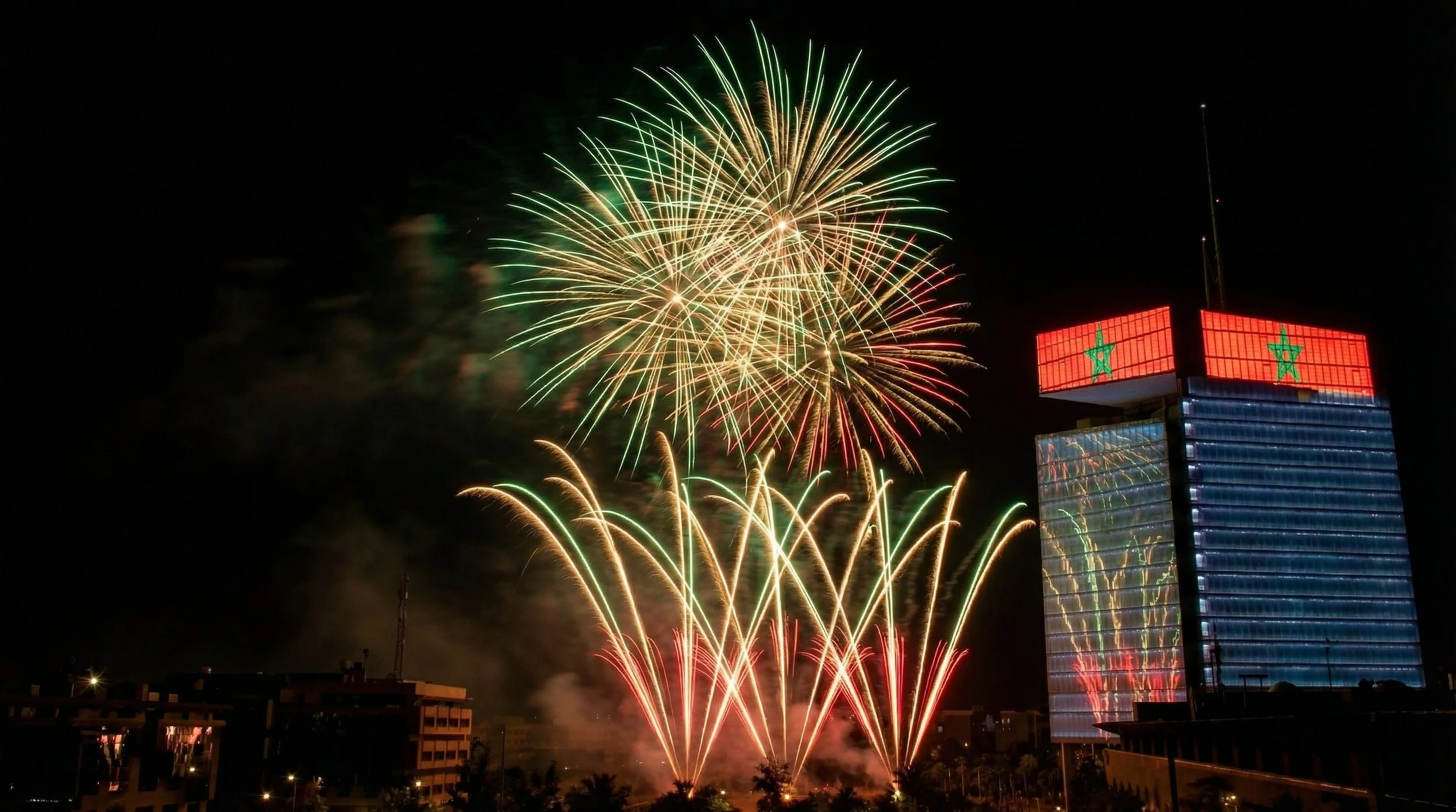 Green and white fireworks above the Maroc Telecom tower in Rabat during the HQ inauguration